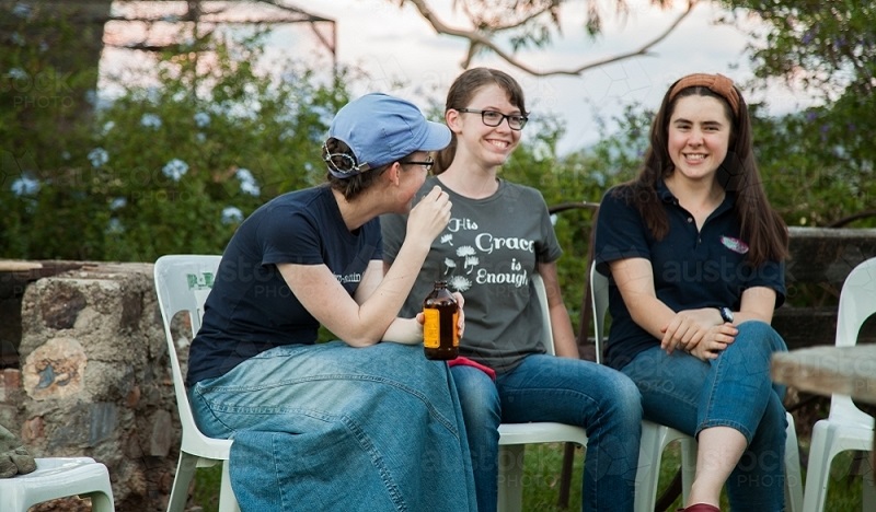 three-teen-girls-talking-together-at-christmas-party-outside-austockphoto-000063575.jpg